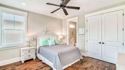a bedroom with a bed and a ceiling fan at NatureWalk at Seagrove 985 in Santa Rosa Beach