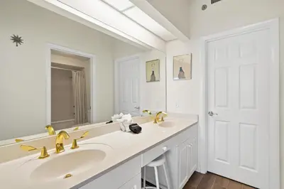 a bathroom with two sinks and a large mirror at High Pointe 431 Gulf Views in Rosemary Beach