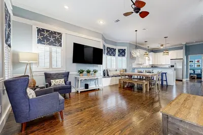 a living room with a dining room and a kitchen at Spacious Home with Private Pool dog-friendly 2 Blocks to Beach in Santa Rosa Beach