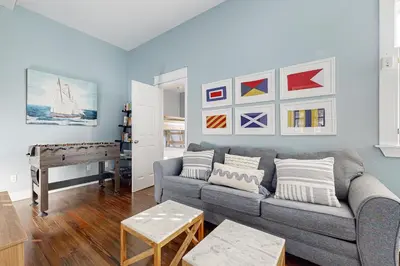a living room with a couch and a piano at Spacious Home with Private Pool dog-friendly 2 Blocks to Beach in Santa Rosa Beach