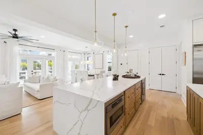 a kitchen and living room with a marble counter top at Beach,Please in Rosemary Beach