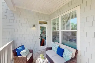 a porch with a couch and chairs and a window at New Cottage Near 30A Rosemary Beach with 2 Master Suites in Inlet Beach