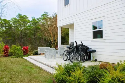 a group of bikes parked next to a house at Brand-new house on Powell Lake near beach & 30A with pool W&D & gym in Inlet Beach