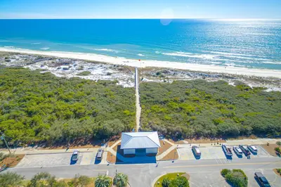 an overhead view of a beach with a building and the ocean at Brand-new house on Powell Lake near beach & 30A with pool W&D & gym in Inlet Beach