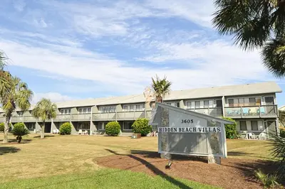 a building with a sign that reads iron beach turtles at Beautiful coastal studio condo with pool in Santa Rosa Beach
