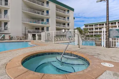 a small pool in front of a apartment building at First-floor condo with sauna gym pool tennis & pickleball in Santa Rosa Beach