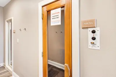 a glass door with a sign on the wall at Gulf-front 3-bedroom condo with bonus bunk room & pickleball in Santa Rosa Beach