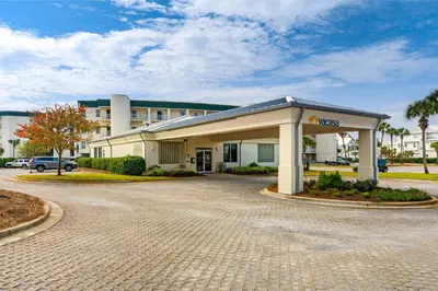 a gas station in front of a building at Gulf-front 3-bedroom condo with balconies off each bedroom & pickleball in Santa Rosa Beach