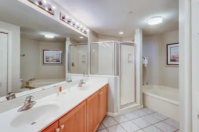 a bathroom with a sink and a shower and a tub at Two-bedroom with bunks balcony overlooking pool & on-site pickleball in Santa Rosa Beach