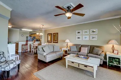 a living room with a couch and a table at Gorgeous 3-bedroom condo with stunning view spacious balcony & pickleball in Santa Rosa Beach
