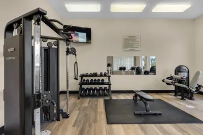 a gym with tread machines and a treadmill at 4th-floor condo with beach ambience lagoon pool gym tennis & pickleball in Santa Rosa Beach