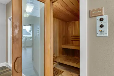 a walk in closet with a glass door at 4th-floor condo with beach ambience lagoon pool gym tennis & pickleball in Santa Rosa Beach