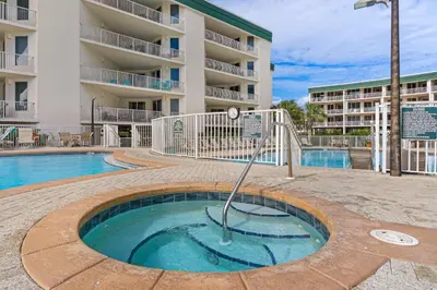 a small pool in front of a apartment building at Gorgeous condo with pool & Gulf view stunning decor bunk beds & pickleball in Santa Rosa Beach