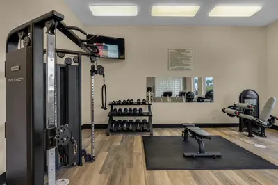 a fitness room with a gym with tread machines at Super-comfy Seagrove condo with spacious pool-view balcony & pickleball in Santa Rosa Beach