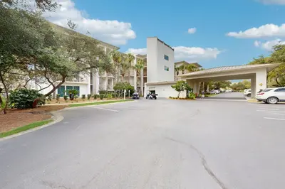 an empty street in front of a building at Beautiful 3rd-floor villa with hot tub tennis pickleball & balcony with views in Seacrest