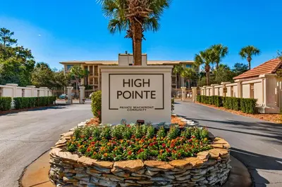 a sign for a high point with flowers at Beautiful 3rd-floor villa with hot tub tennis pickleball & balcony with views in Seacrest