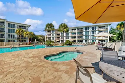 a resort with a swimming pool and a hotel at Amazing Santa Rosa Beach condo with pool hot tub & pickleball in Seacrest