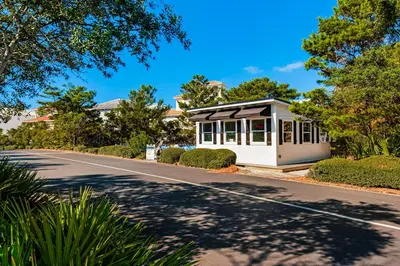 a house with a road in front of it at Amazing Santa Rosa Beach condo with pool hot tub & pickleball in Seacrest