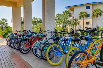 a row of bikes parked next to a building at Amazing Santa Rosa Beach condo with pool hot tub & pickleball in Seacrest