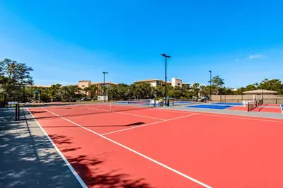 a tennis court with two tennis courts at Amazing High Pointe condo with grill hot tub pool tennis & pickleball in Seacrest