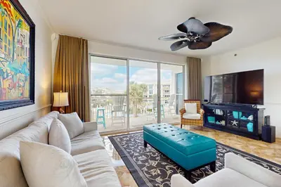 a living room with a couch and a tv at Amazing High Pointe condo with grill hot tub pool tennis & pickleball in Seacrest