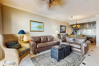 a living room with couches and a couch and chairs at Elegant getaway with stunning view lagoon pool & pickleball - close to shops in Seacrest
