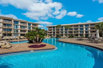a pool at a resort with condos at Elegant getaway with stunning view lagoon pool & pickleball - close to shops in Seacrest
