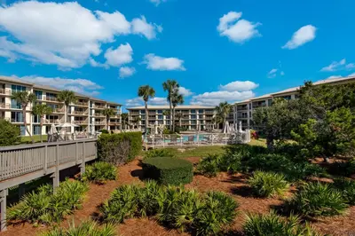 a view of a resort with trees and plants at Gorgeous beach condo with furnished balcony panoramic view & pickleball in Seacrest