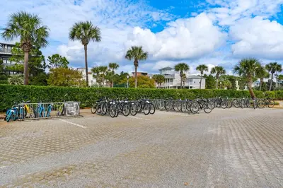 a row of bikes parked in a parking lot at Gulf-front view & spacious condo with wraparound balcony & pickleball in Santa Rosa Beach