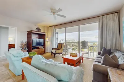 a living room with two couches and a tv at Snowbird-friendly condo with pickleball on the beach close to shops & dining in Seacrest