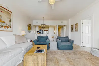 a living room with a couch and two chairs and a table at Condo on the beach with tennis pickleball shuffleboard & balcony in Seacrest