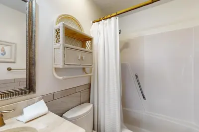 a bathroom with a toilet and a shower at Dog-friendly beachfront townhouse with balcony 2 bikes W&D in Rosemary Beach