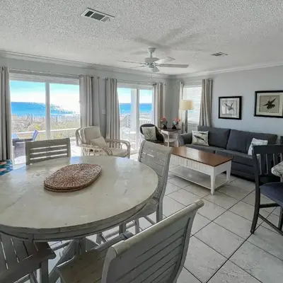 Lovely first floor condo with ocean views patio & grill - steps from the beach