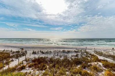 a view of the beach with the ocean in the background at Charming gulf-front 2nd floor condo in South Walton Outdoor showers on-site in Santa Rosa Beach