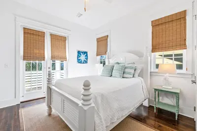 a white bedroom with a bed and windows at Seagrove Serenity 4BR Coastal Retreat with Pool & Bikes in Santa Rosa Beach
