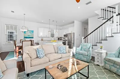 a living room with a couch and a table at Seagrove Serenity 4BR Coastal Retreat with Pool & Bikes in Santa Rosa Beach