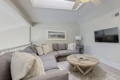 a living room with a couch and a table at Fourth floor oceanfront condo with pool access ocean views and washer&dryer in Santa Rosa Beach