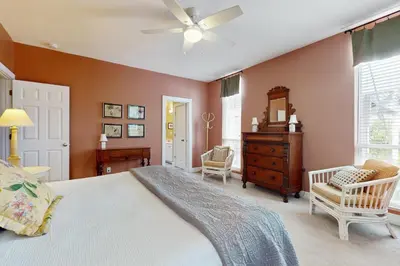 a bedroom with a bed and a ceiling fan at Coastal haven near the beach off scenic 30A with two pools & porch- dog-friendly in Santa Rosa Beach