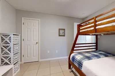 a bedroom with a bunk bed and a closet at Seagrove Beach condo with AC pool & tennis - steps from the Gulf of Mexico in Santa Rosa Beach