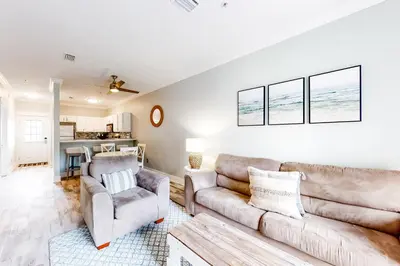 a living room with a couch and two chairs at Peaceful condo with pool access central AC and washer&dryer in Santa Rosa Beach