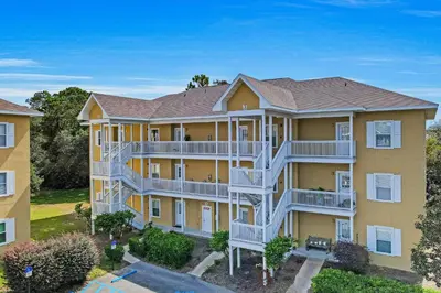 an aerial view of a large apartment building at Third-floor condo with pool washer&dryer fast WiFi & central AC - near beach in Santa Rosa Beach