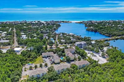 an aerial view of a resort with a body of water at Third-floor condo with pool washer&dryer fast WiFi & central AC - near beach in Santa Rosa Beach