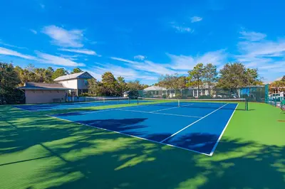 a tennis court with a tennis court at 2nd-floor condo near beach with outdoor pool tennis balcony washer&dryer AC in Santa Rosa Beach