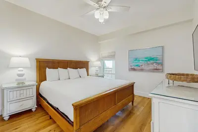 a bedroom with a bed and a ceiling fan at Lavish High Pointe condo with resort pool amazing ocean view & pickleball in Seacrest