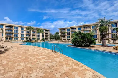a resort with a swimming pool and buildings at Water-view condo with pool hot tub & pickleball in Rosemary Beach