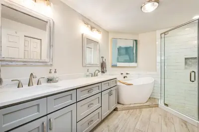 a bathroom with two sinks and a tub and a shower at Chic first-floor condo with Gulf & pool view & pickleball - steps to beach in Santa Rosa Beach