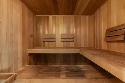 two chairs in a sauna with wooden walls at Beach-view condo with outdoor pool hot tub sauna tennis BBQ & beach access in Santa Rosa Beach