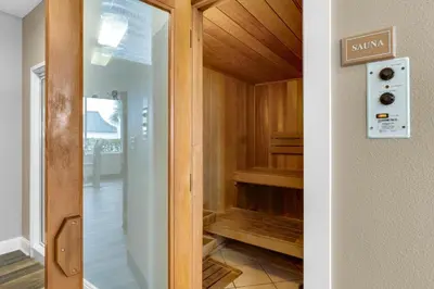 a glass door to a walk in closet at COMPLETELY UPDATED with beach access pool hot tub tennis pickleball & gym in Santa Rosa Beach