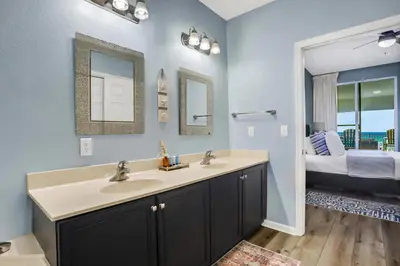 a bathroom with a sink and two mirrors at Dunes of Seagrove condo with pool hot tub sauna gym & tennis pickleball in Santa Rosa Beach