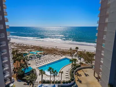 a view of the beach from the balcony of a resort at Dunes of Panama E1702 - Sunrise & Sea Breezes in Panama City Beach
